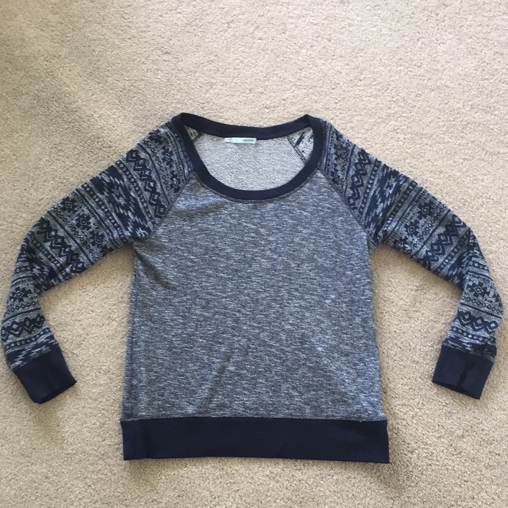 Navy Maurice’s sweater.